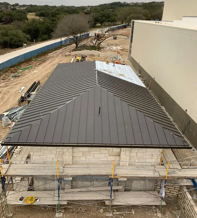 Metal roof new construction with scaffolding in Burlington